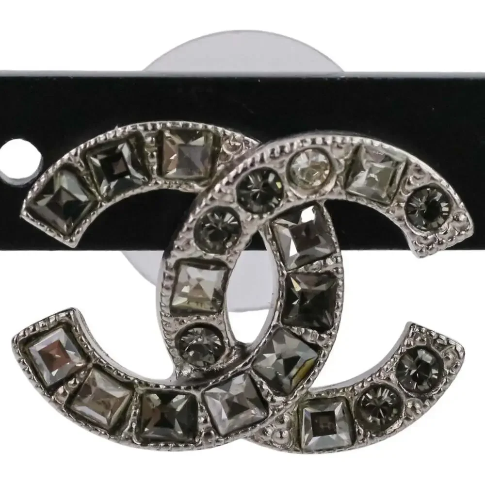CHANEL Silver Logo Earrings